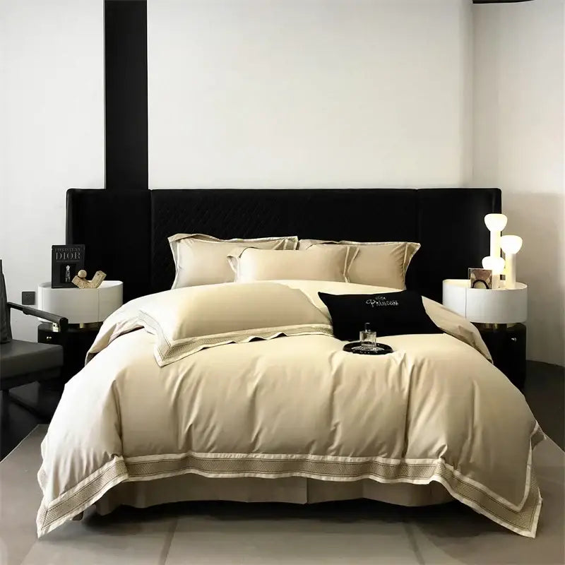 Cream-colored satin bedding set with gold-toned piping and black velvet headboard decorbites 1000tc luxury embroidery