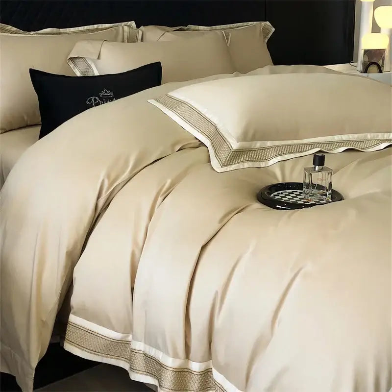 Cream-colored satin bedding set with gold-toned embroidered trim decorbites 1000tc luxury embroidery design