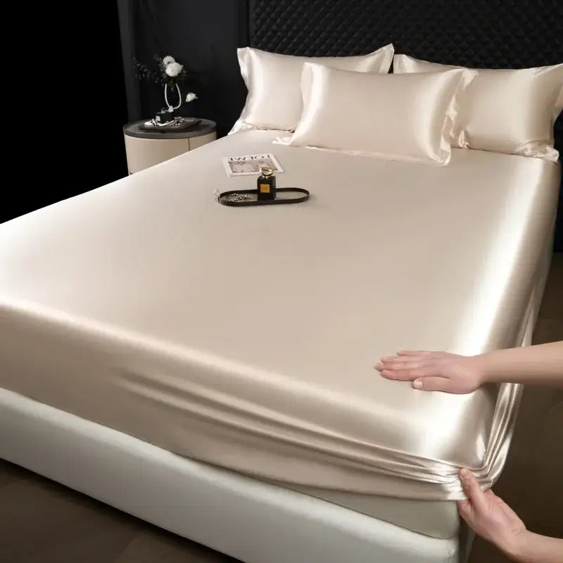 Luxury cream mulberry silk fitted sheet set with smooth glossy finish in a cream-colored satin fitted sheet