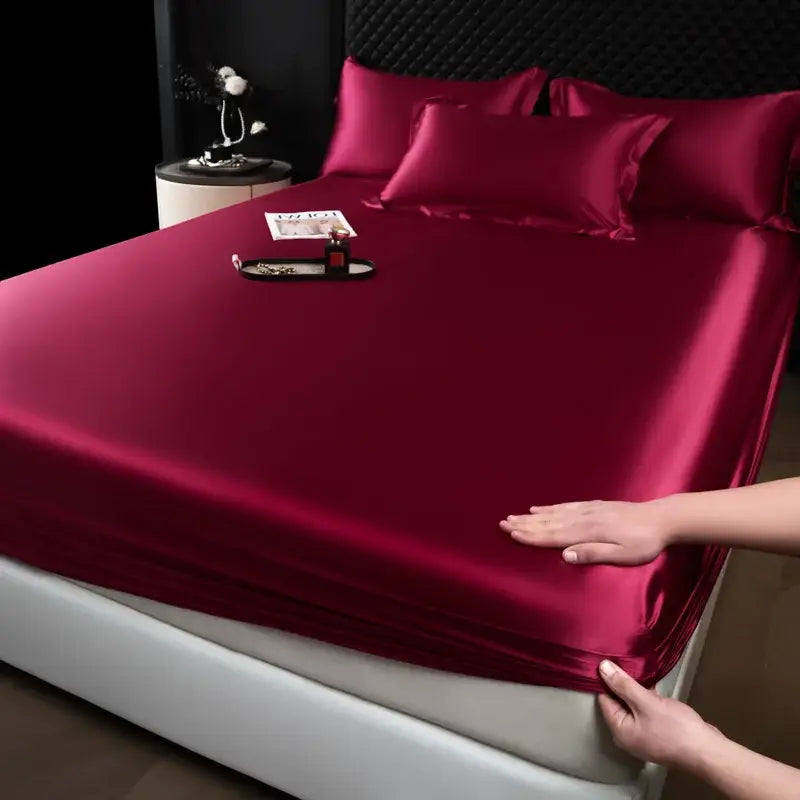 Luxury burgundy satin fitted sheet with a smooth glossy finish from cream mulberry silk sheet set for bedroom use