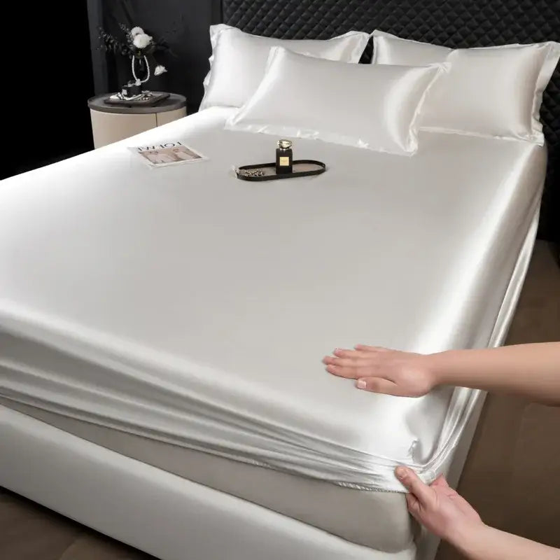 Luxury cream mulberry silk fitted sheet set with satin finish and elasticized edges for a smooth bedroom bedding look