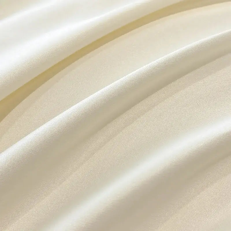 Luxury cream and pink ice silk floral bedding sets featuring cream-colored satin fabric with smooth glossy finish decorbites ice silk