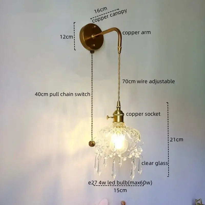 Antique brass copper led wall sconce with clear glass shade and dangling crystal droplets for luxury bedroom lighting