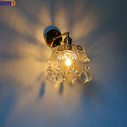 Brass-finished wall sconce with faceted crystal shade and dangling teardrop crystals luxury crystal copper led wall lighting