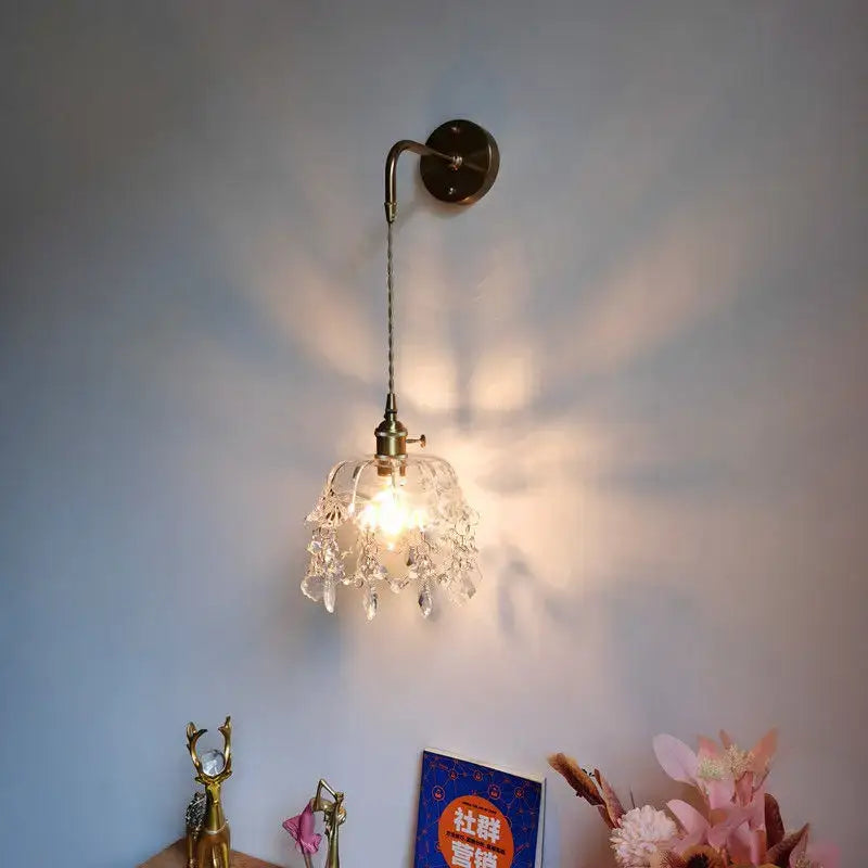 Luxury crystal copper led wall sconce with brass finish and clear glass crystals for elegant bedroom lighting