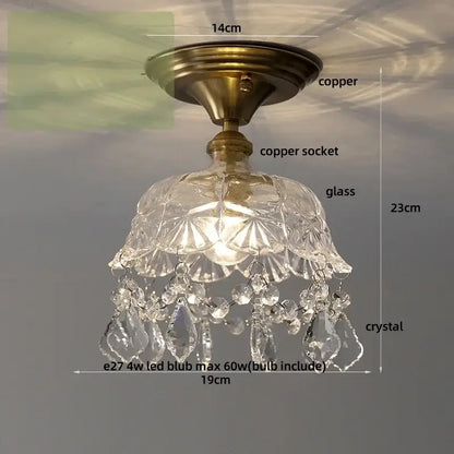 Antique brass-finished ceiling light with faceted glass shade and dangling crystal teardrops for crystal glass luxury decorbites decor