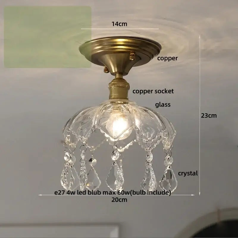 A luxury crystal glass ceiling light with a brass copper base and crystal glass luxury teardrop decorbites decor