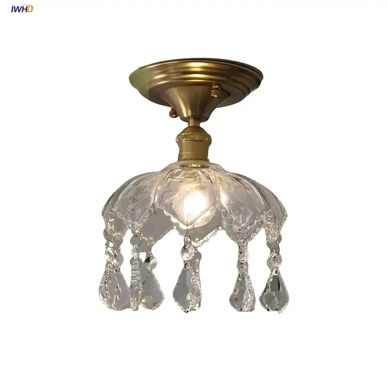 A clear crystal glass luxury ceiling light with brass base and teardrop decorbites crystal glass crystals for bedroom decor
