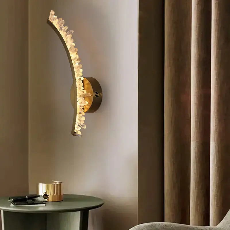 Curved gold metal wall sconce with decorbites crystal gold cascading clear crystals for living room warm glow decor