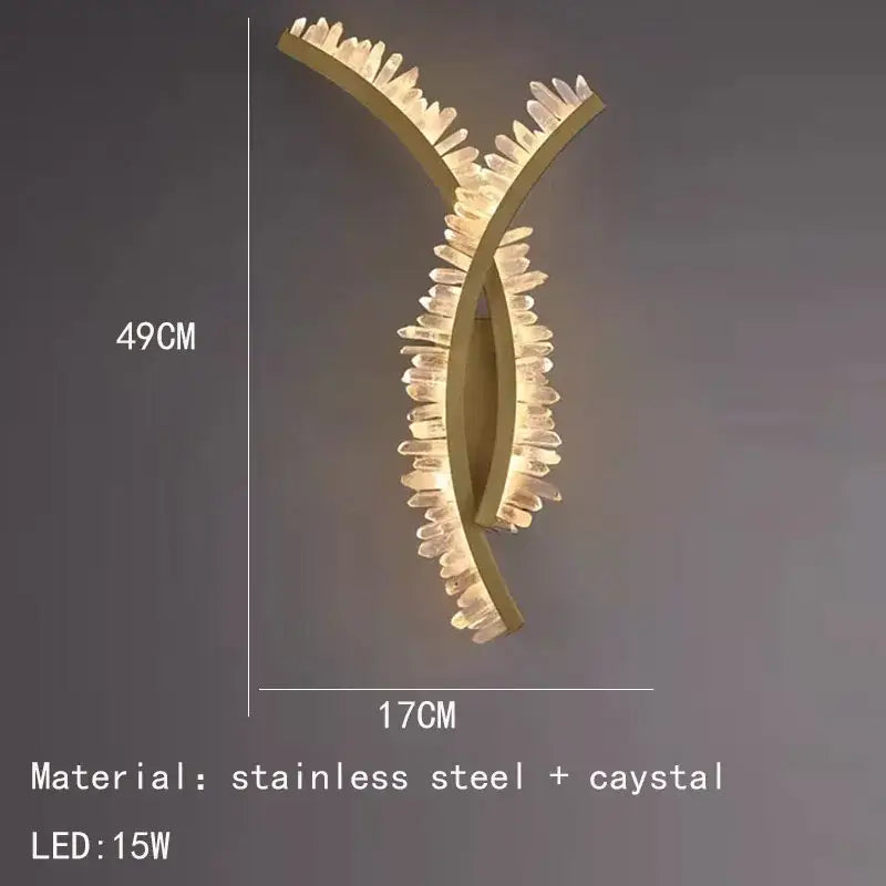 Luxury crystal gold metal wall sconce with sleek curved design and clear crystal accents for warm living room decorbites glow