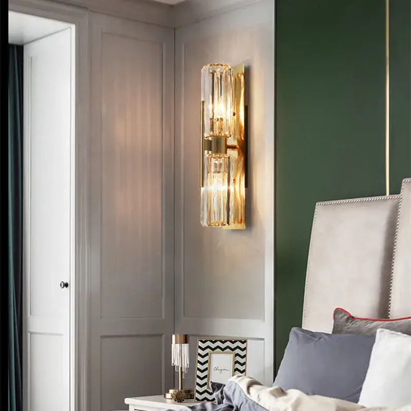Luxury crystal gold wall lamp with gold-toned vertical crystal tubes for elegant living room and bedroom lighting decorbites crystal gold wall lamp