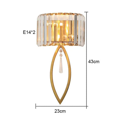 Luxury crystal gold wall lamp with gold-toned frame, cylindrical crystal shade, and hanging clear glass beads for decorbites wall lamp