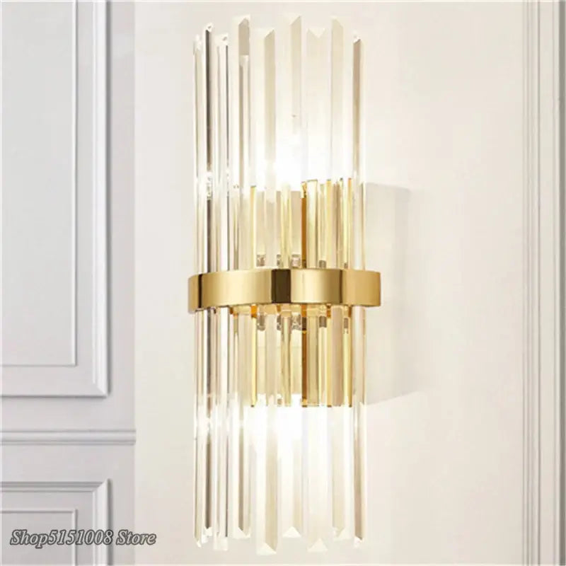 Luxury decorbites crystal golden wall lamp featuring gold-toned metal and vertical crystal rods for elegant bedroom decor