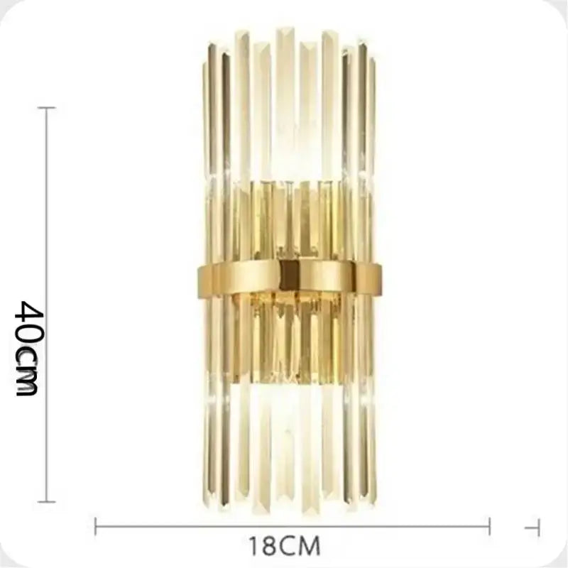 Luxury crystal golden wall lamp featuring gold-toned sconce with vertical crystal rods and central metallic band for decorbites crystal golden decor