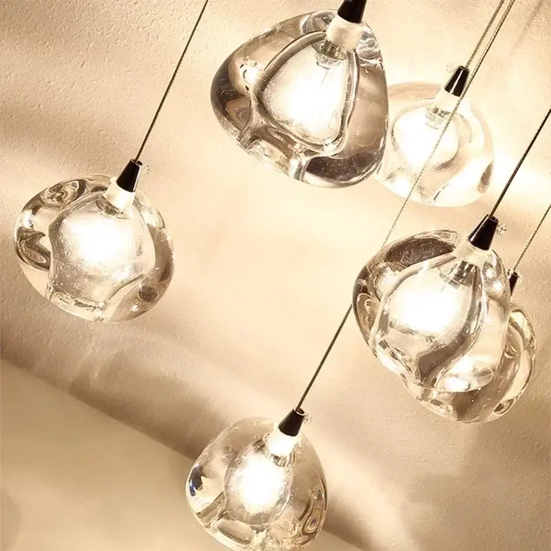 Luxury crystal led chandelier featuring clear hand-blown glass teardrop pendants with black metal fixtures by decorbites crystal led