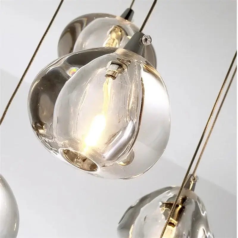 Luxury crystal led chandelier featuring clear hand-blown glass pendant light with warm glow and metallic accents by decorbites crystal led