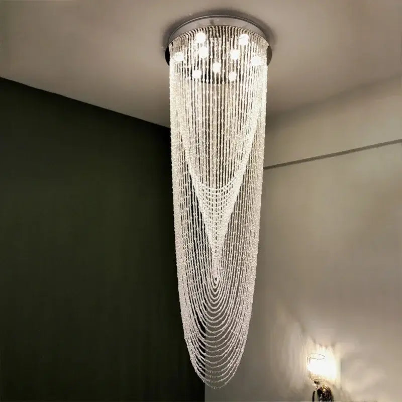 Luxury crystal tassel stair chandelier with cascading clear faceted beads and sleek metallic base for white staircase decorbites crystal tassel