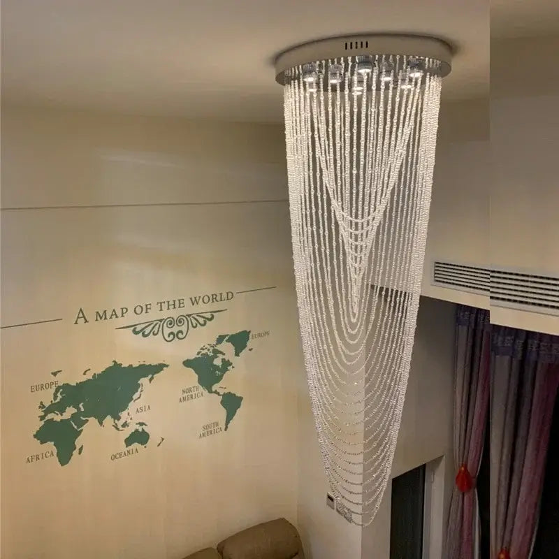 Luxury crystal tassel stair chandelier with cascading clear beads and sleek silver base for elegant white staircase decorbites crystal tassel