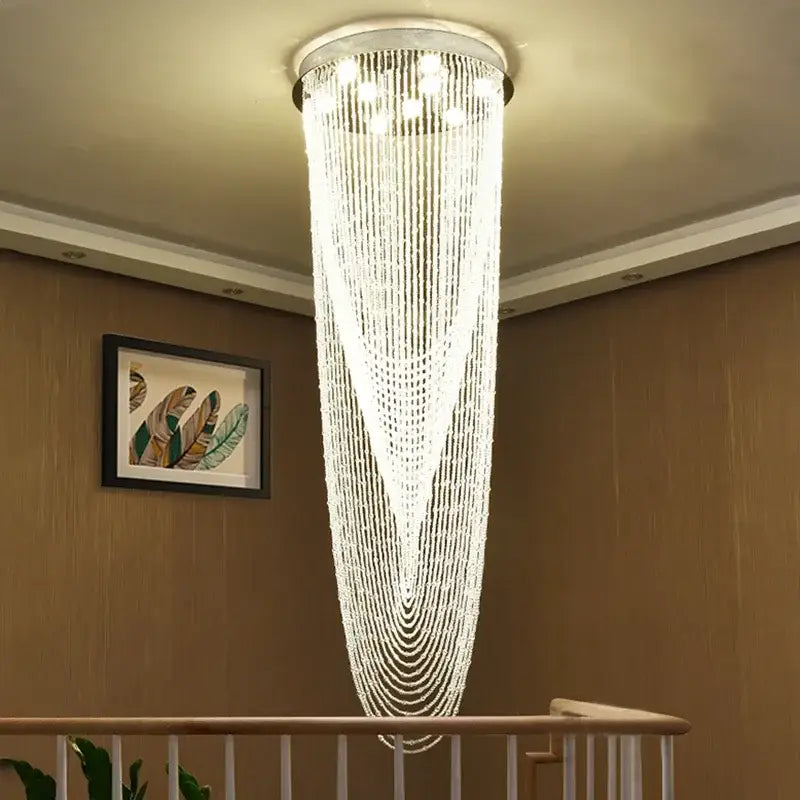 Luxury crystal tassel stair chandelier with cascading clear beads and chrome fixture for white staircase decorbites crystal tassel