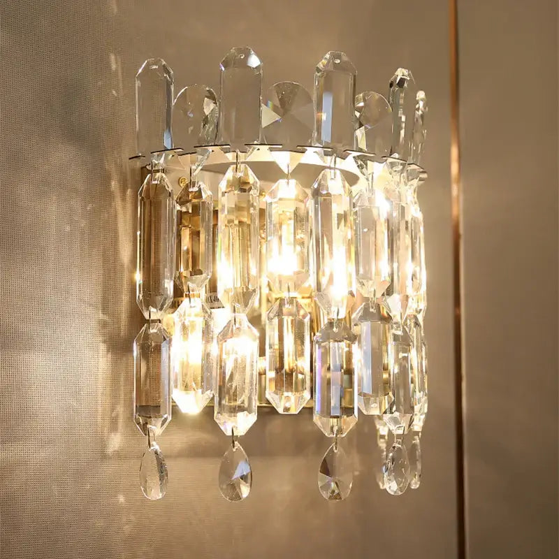 Luxury crystal wall lamp featuring faceted clear glass prisms and teardrop crystals for elegant decorbites crystal wall decor