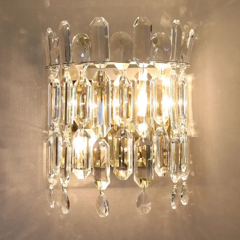 Luxury crystal wall lamp with faceted clear glass prisms and teardrop crystals for elegant bedroom decorbites crystal wall