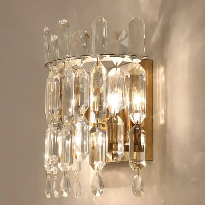 Luxury crystal wall lamp with gold-toned metal frame and cascading clear glass prisms for elegant decorbites crystal wall decorbites crystal wall lamp
