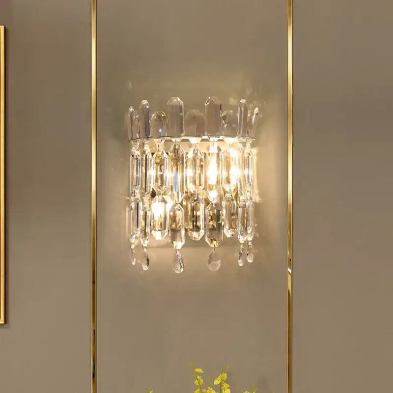 Luxury crystal wall lamp with clear faceted glass prisms and gold-toned metal frame for elegant decorbites crystal wall decor