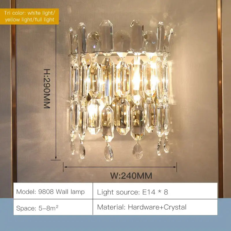 Luxury gold-toned decorbites crystal wall lamp with cascading clear glass prisms for elegant bedroom decor