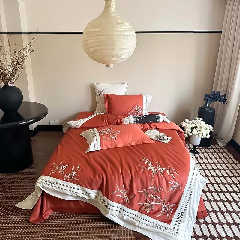Luxury coral-colored bedding set with delicate bamboo embroidery and white satin border in 1000tc egyptian cotton