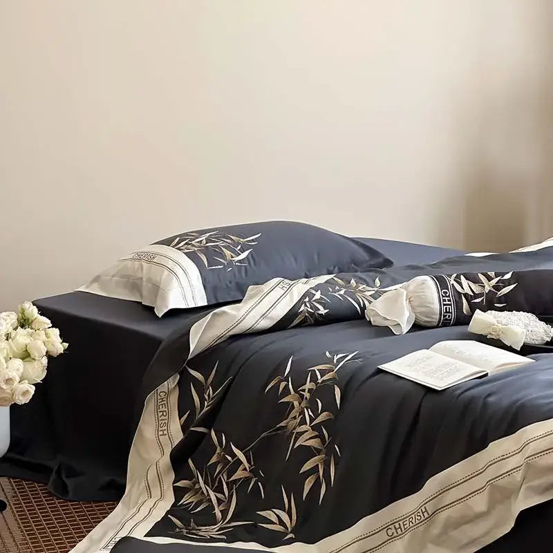 Elegant navy blue satin bedding set with gold bamboo leaf embroidery and cream trim in 1000tc egyptian cotton