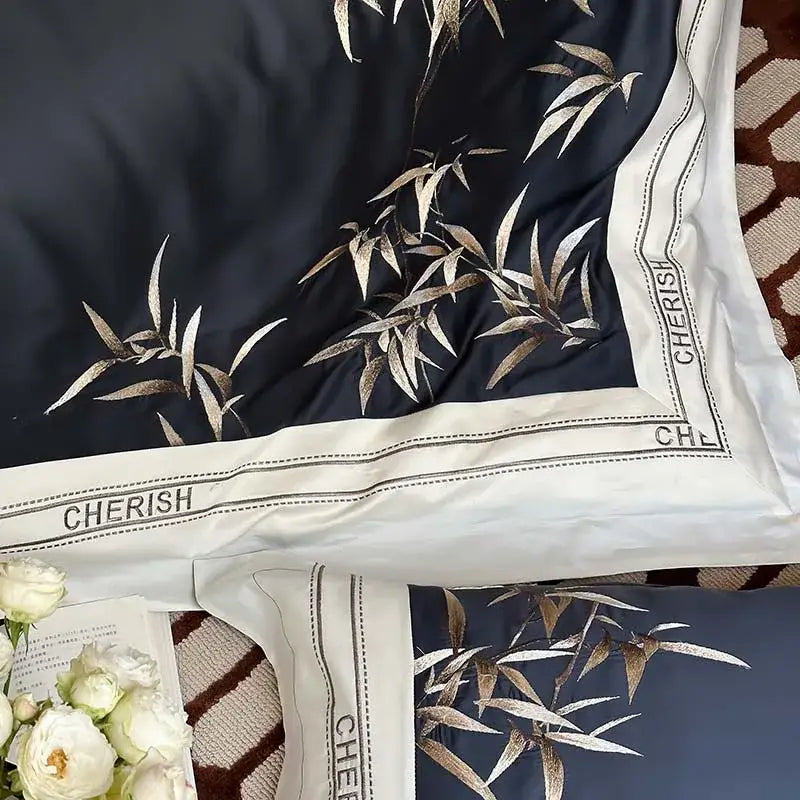 Dark blue satin pillowcase with gold bamboo embroidery and cherish lettering in 1000tc egyptian cotton bedding set