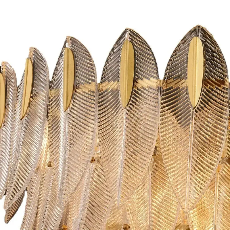 A luxury chandelier featuring decorbites glass leaf design with ribbed glass leaves and polished gold accents for living rooms
