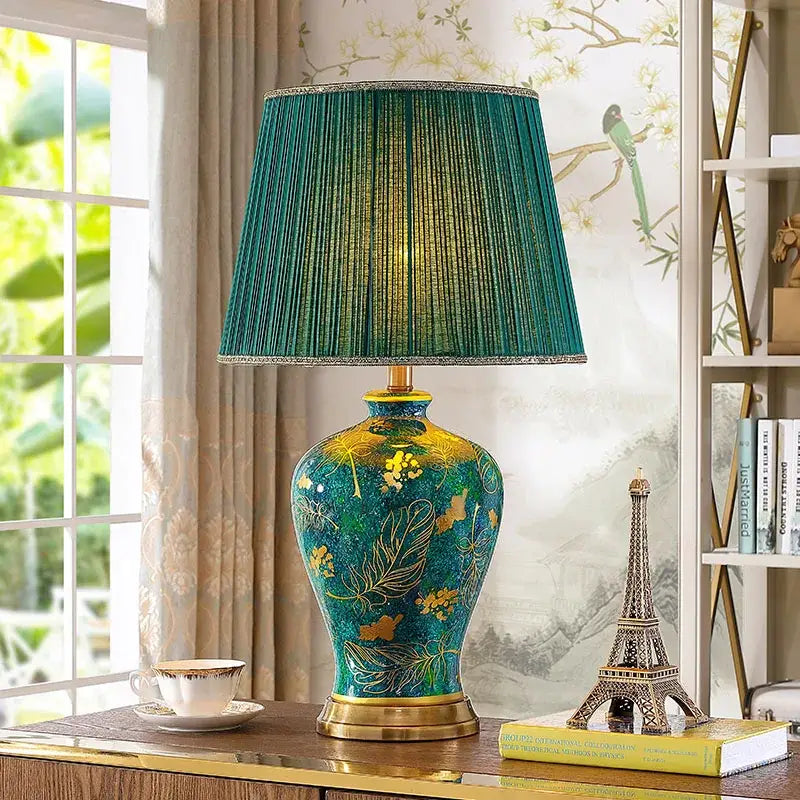 Luxury emerald queen green ceramic table lamp with vibrant teal and gold floral design and pleated green shade for bedroom lighting