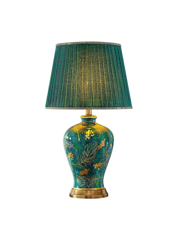 Luxury emerald queen green table lamp with a teal and gold floral green ceramic base and pleated fabric shade for bedroom lighting