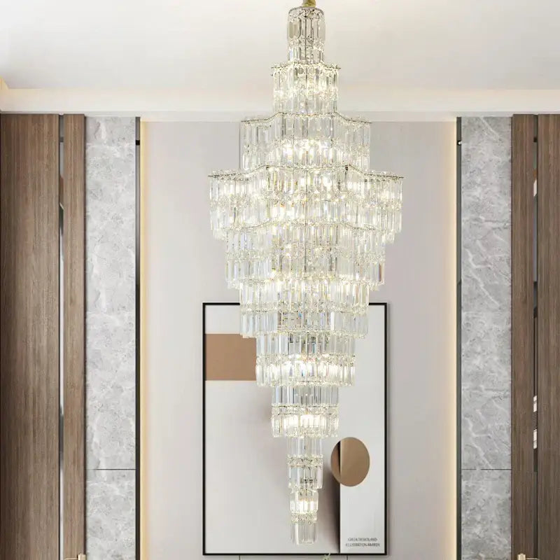 Luxury european crystal staircase chandelier with cascading rectangular prisms and gold-toned top by decorbites crystal