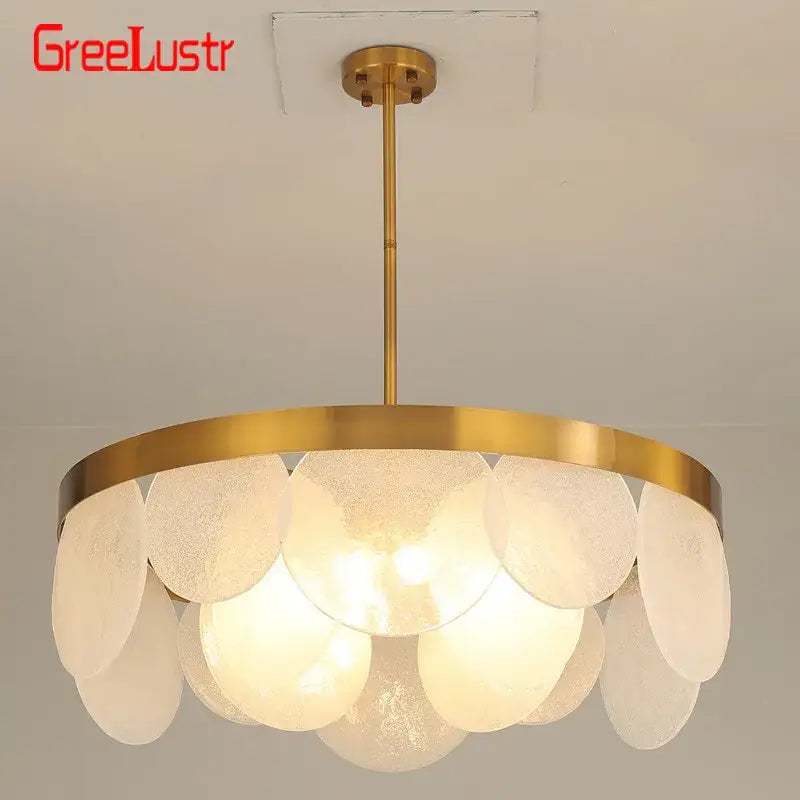 Gold-finished copper led pendant light with layered frosted glass discs in circular pattern for dining room use