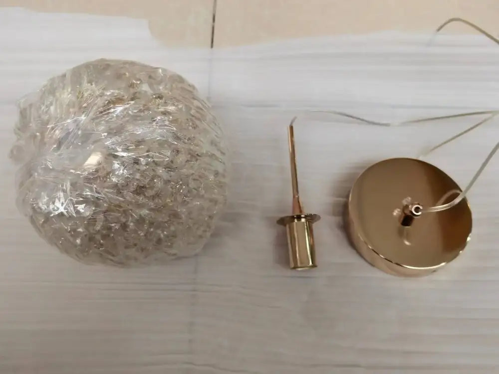 Luxury gold and amber crystal ball pendant light with clear globe and gold-toned metal hardware for bedroom decorbites pendant light