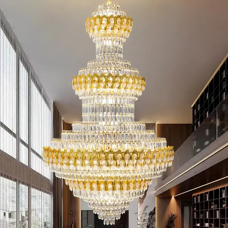 Luxury gold and clear crystal chandelier with multi-tiered clear crystal droplets and gold-toned metallic accents decorbites deluxe crystal