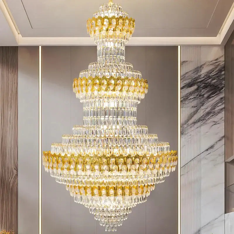 Luxury gold and clear crystal chandelier with cascading prisms and metallic accents for living room decorbites deluxe crystal