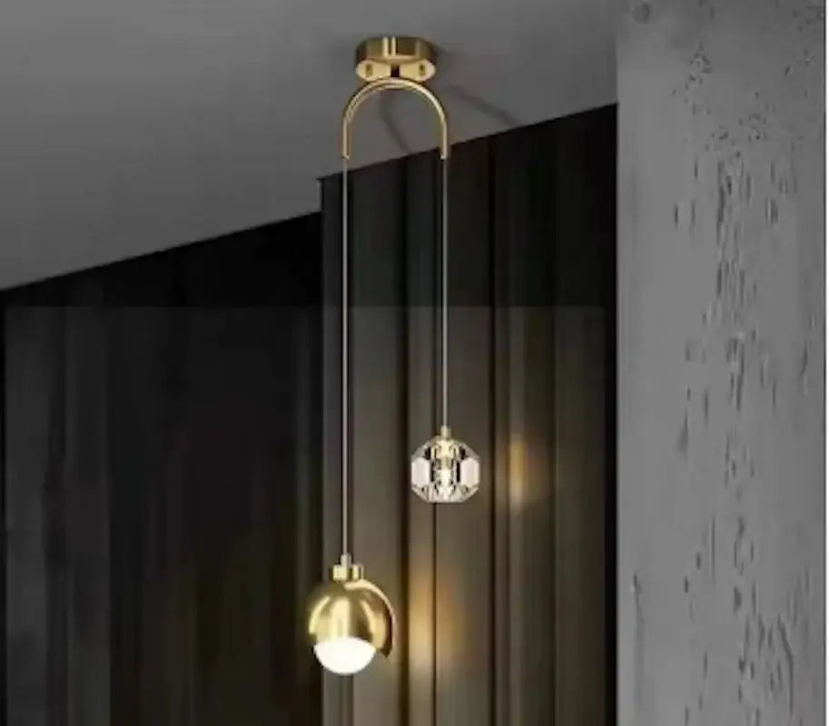 Luxury gold and crystal glass ball pendant light with curved metal arm and two hanging spherical fixtures for living room decorbites glass ball pendant