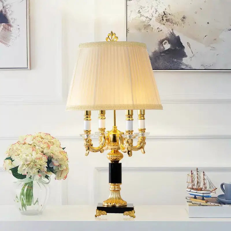 Luxury gold and black crystal table lamp with cream pleated shade and black marble base for black crystal bedroom decor