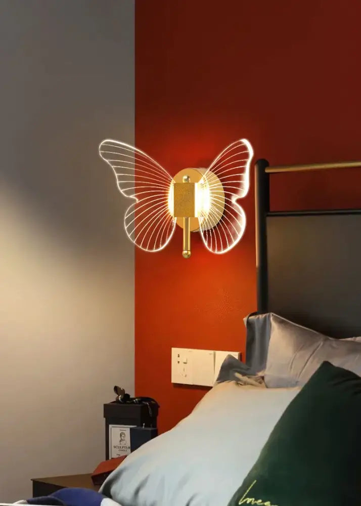 Luxury gold butterfly copper wall lamp with illuminated wireframe wings for elegant bedroom decorbites butterfly copper sconce