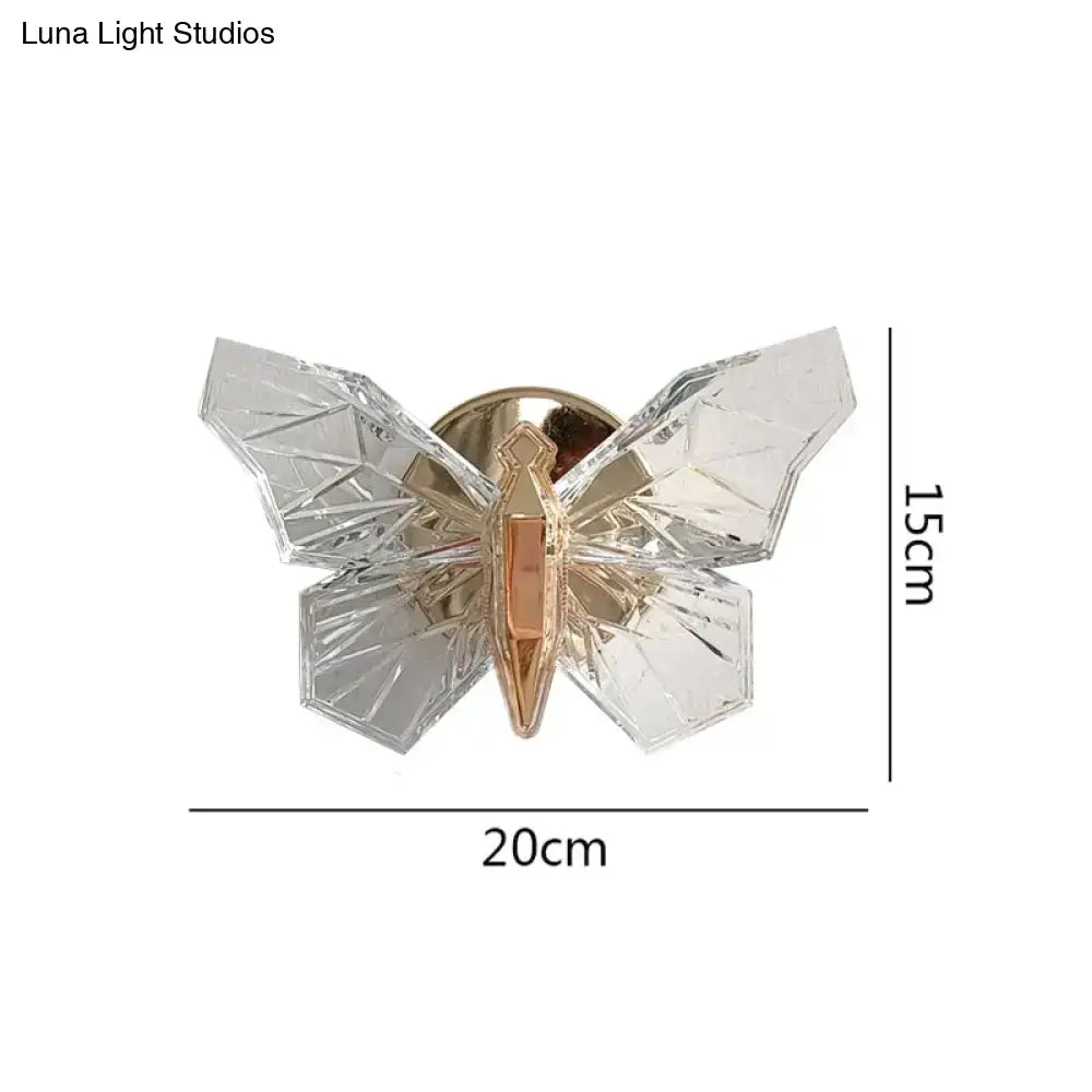 Clear faceted crystal butterfly pin with gold toned center and metallic backing for luxury gold butterfly wall lamp