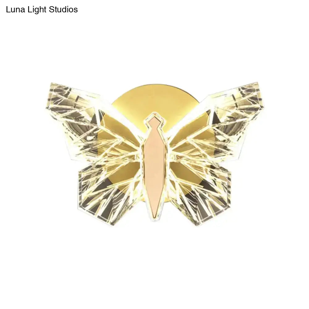 Luxury gold butterfly wall lamp with faceted crystal wings and illuminated body for bedroom lighting