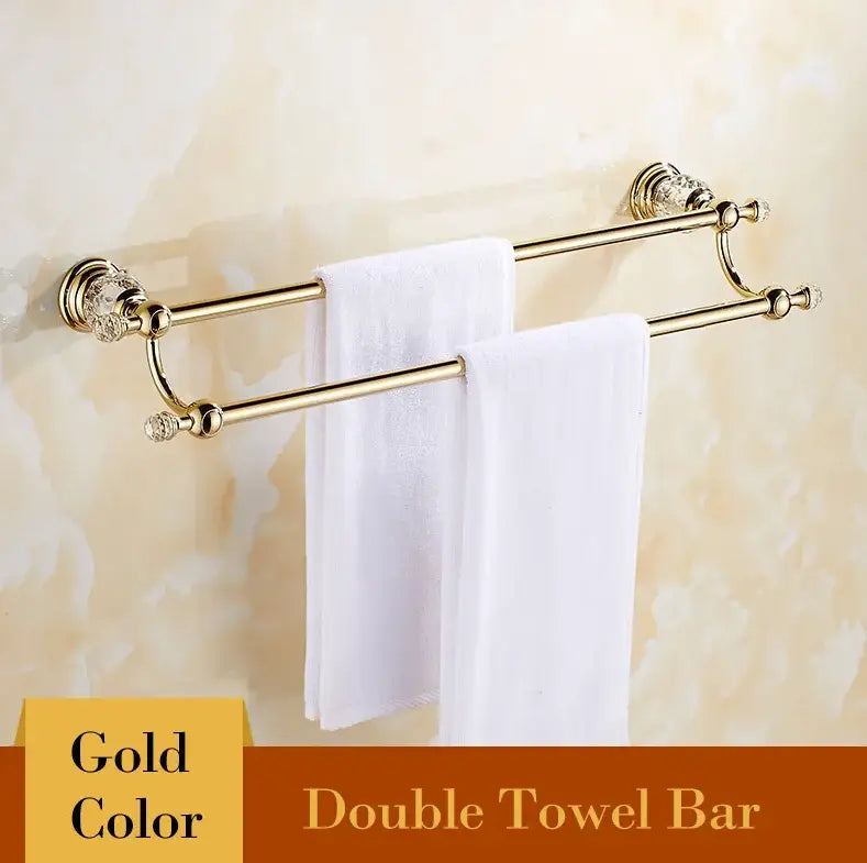 Gold-colored double towel bar with crystal embellishments from luxury gold and crystal bathroom set decorbites brass hardware
