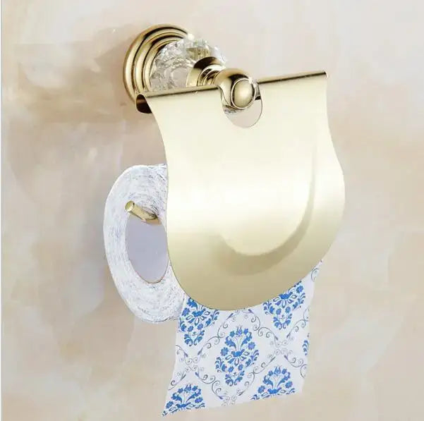 Gold-toned toilet paper holder with crystal knob and curved design in luxury crystal bathroom set by decorbites brass
