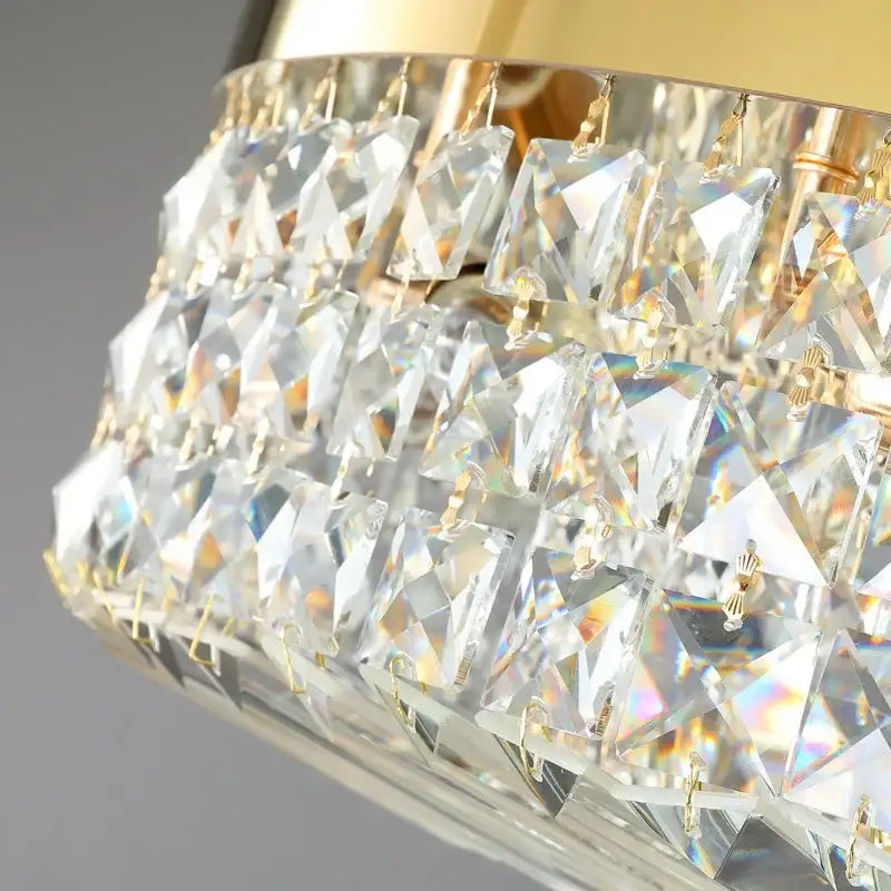 Luxury gold crystal ceiling chandelier with cascading triangular prisms refracting vibrant rainbow light for dining room decorbites crystal ceiling