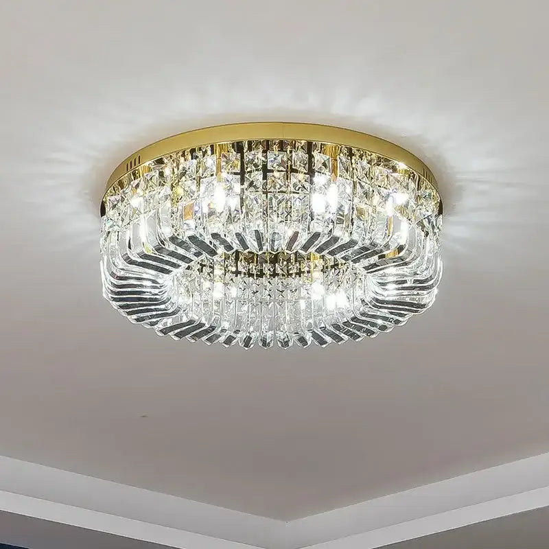 Luxury gold crystal ceiling chandelier with gold-toned metal frame and cascading clear prisms decorbites crystal ceiling light