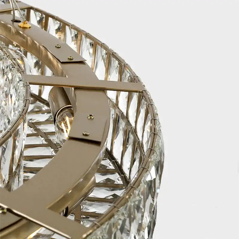 Luxury gold crystal circle pendant chandelier with a sleek brass frame and faceted crystals for elegant dining room lighting decorbites crystal circle
