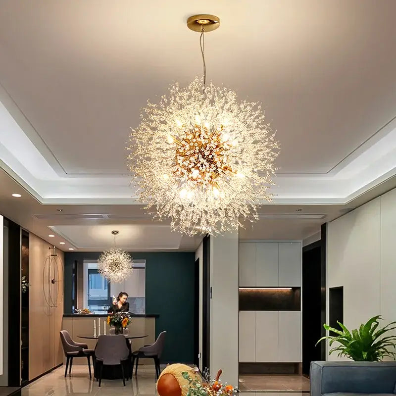 A sparkling gold and clear crystal decorbites dandelion chandelier with spherical design for living room light